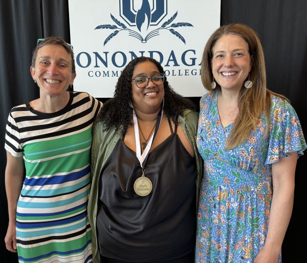 Pinnacle Award winner Ammale Yousuf (center) with OCC's Colleen Stevens (left) and Leslie Reid (right).