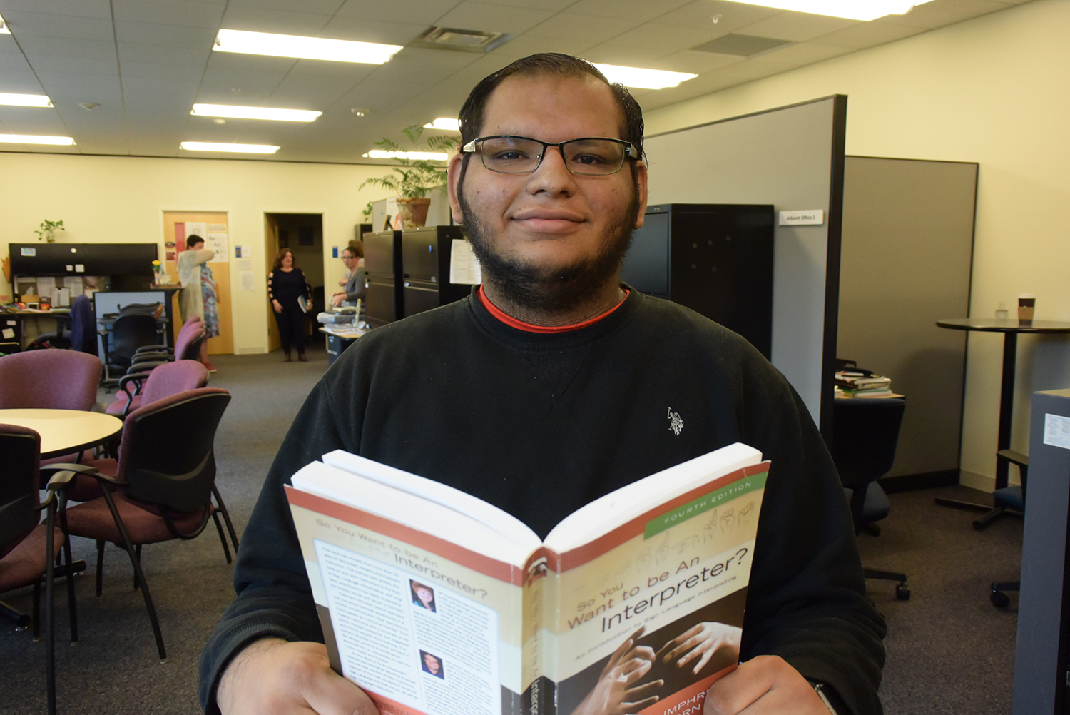 A student studying ASL