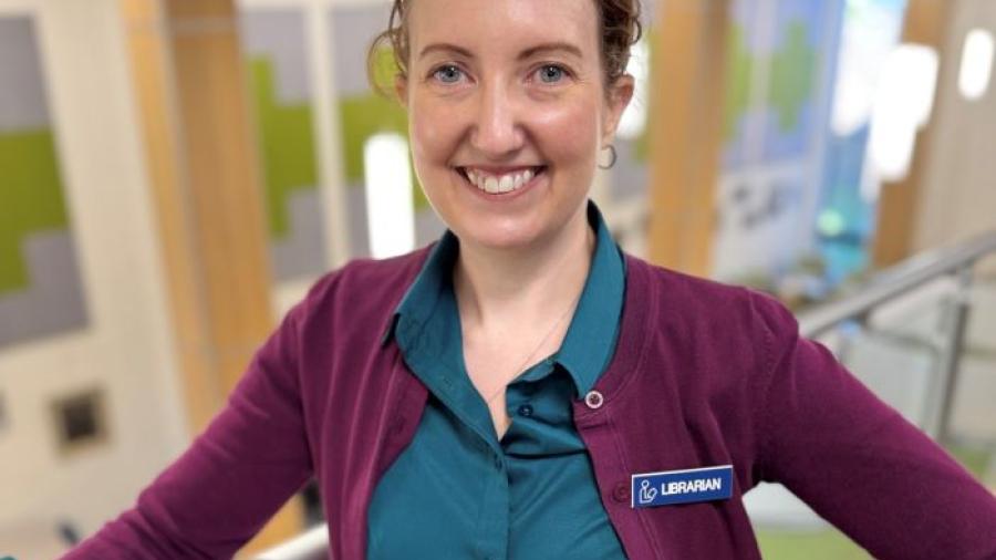 OCC Professor and Librarian Michelle Malinovsky is a member of the inaugural class of SUNY's AI for the Public Good Fellows. She's pictured in the library in Coulter Hall.