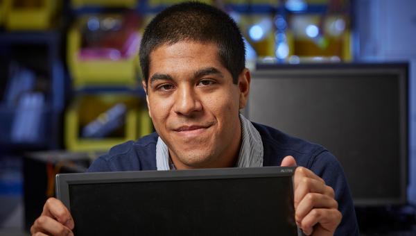 A business technology student studying