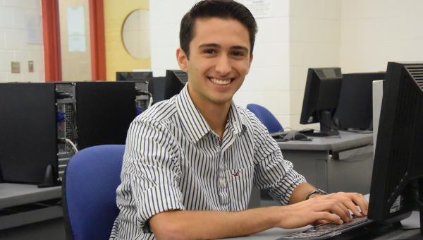 Student sitting at a computer