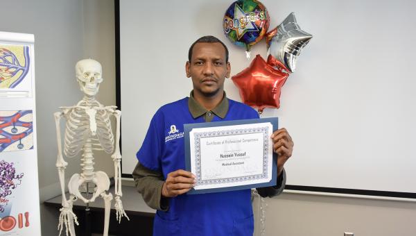 An OCC graduate with his certifiate