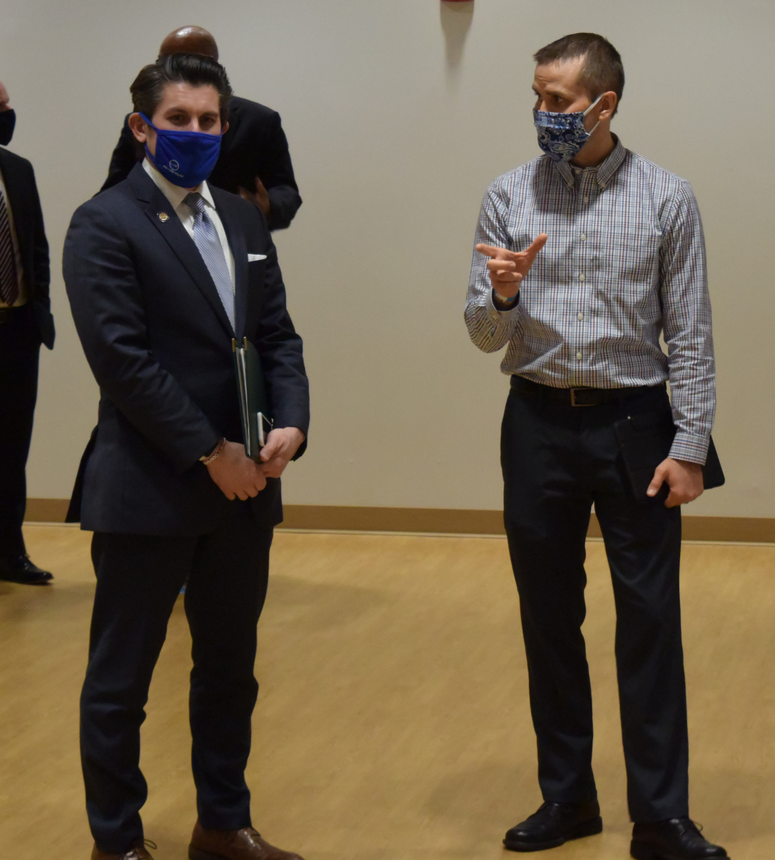 SUNY Chancellor Dr. Jim Malatras (left) speaks with Dr. Sean Vormwald (right), OCC's Director of Sustainability and Environmental Health & Safety while observing the College's COVID-19 testing.