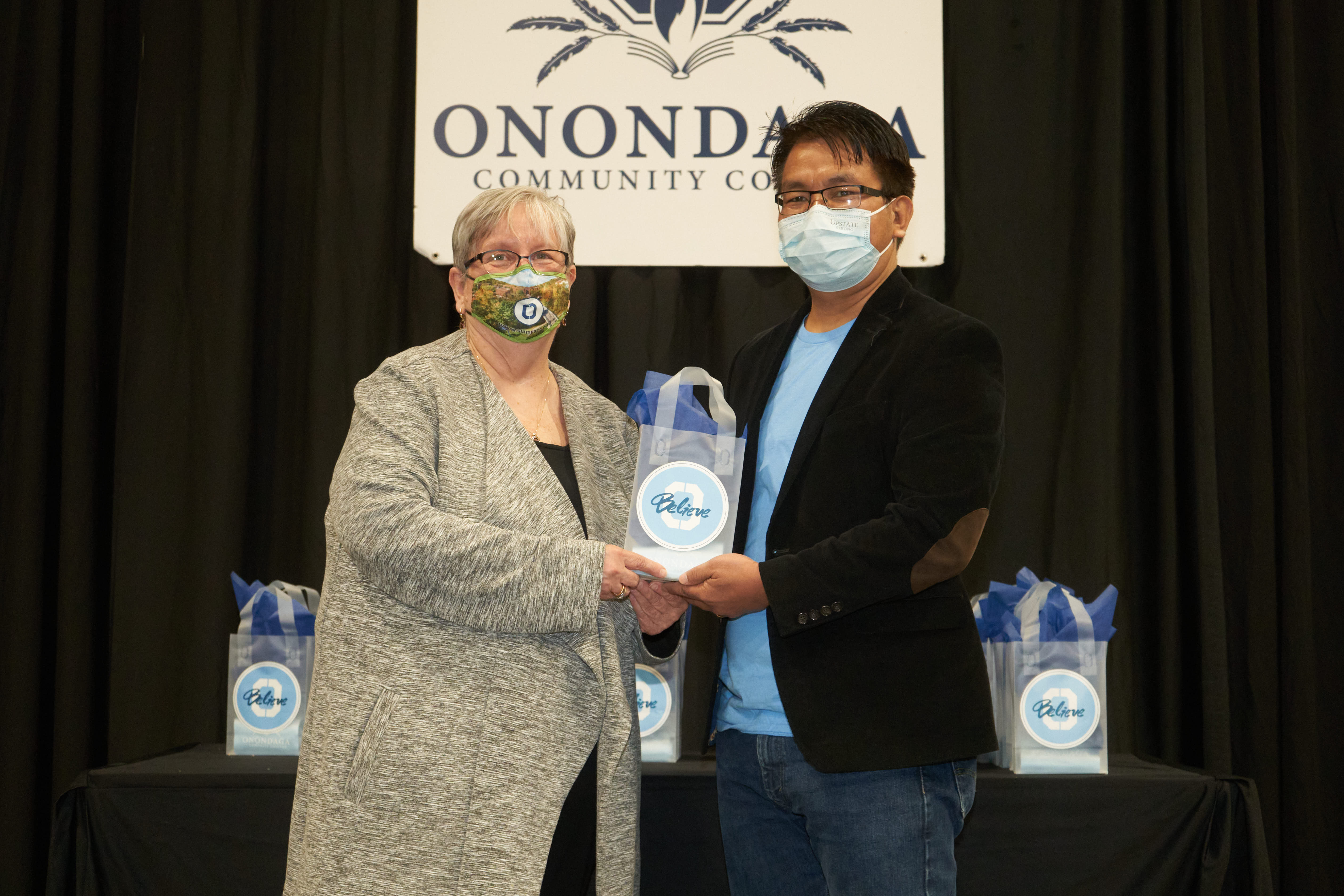 Communication Studies Curriculum Honoree Roben Awi (right) is pictured with OCC President Dr. Casey Crabill (left).