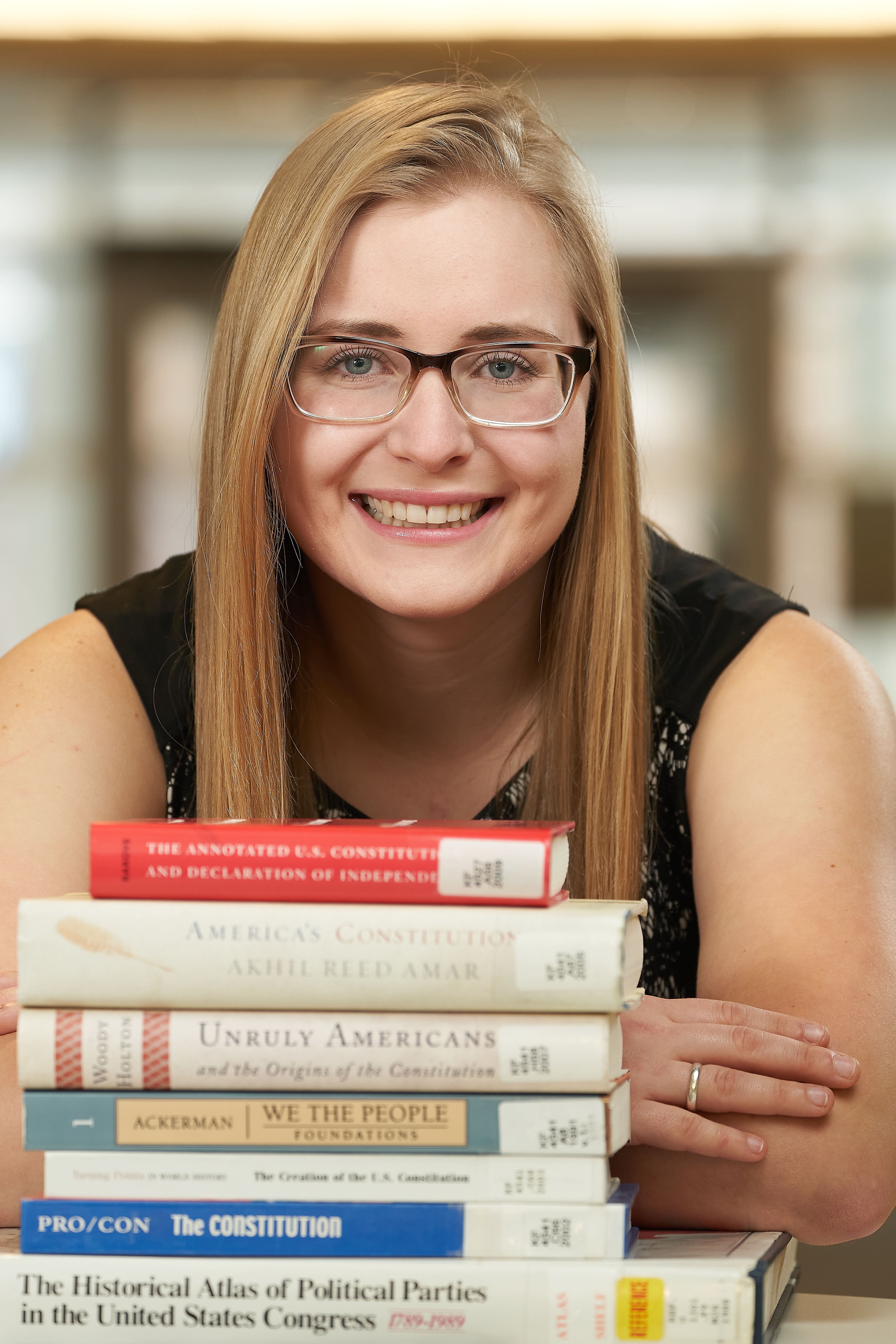 Woman with books in front of her 