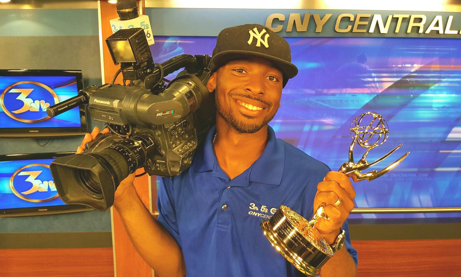 Quindell Williams '08 is pictured with his Emmy Award in 2016.
