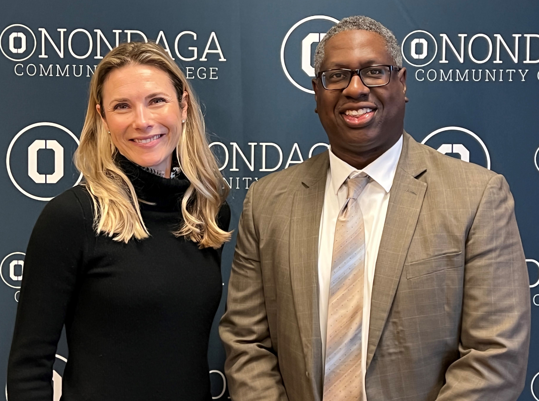Carley Graham Garcia, Amazon's Head of Community Affairs in New York (left) is pictured with OCC President Dr. Warren Hilton (right).