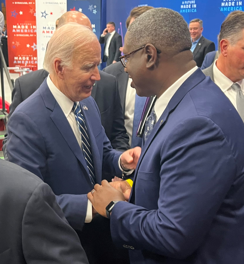 President Joe Biden (left) shakes hands with OCC President Dr. Warren Hilton (right) after the event.