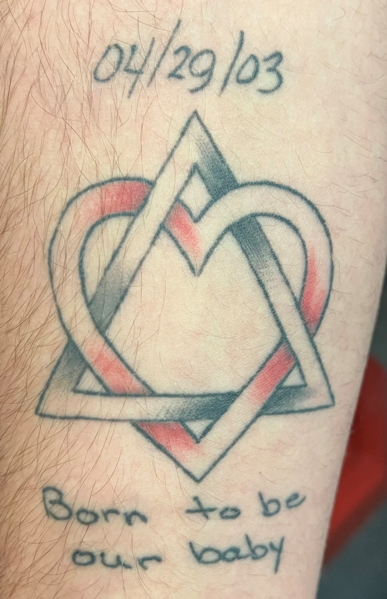Eric Shear has the adoption logo tattooed on his right arm.