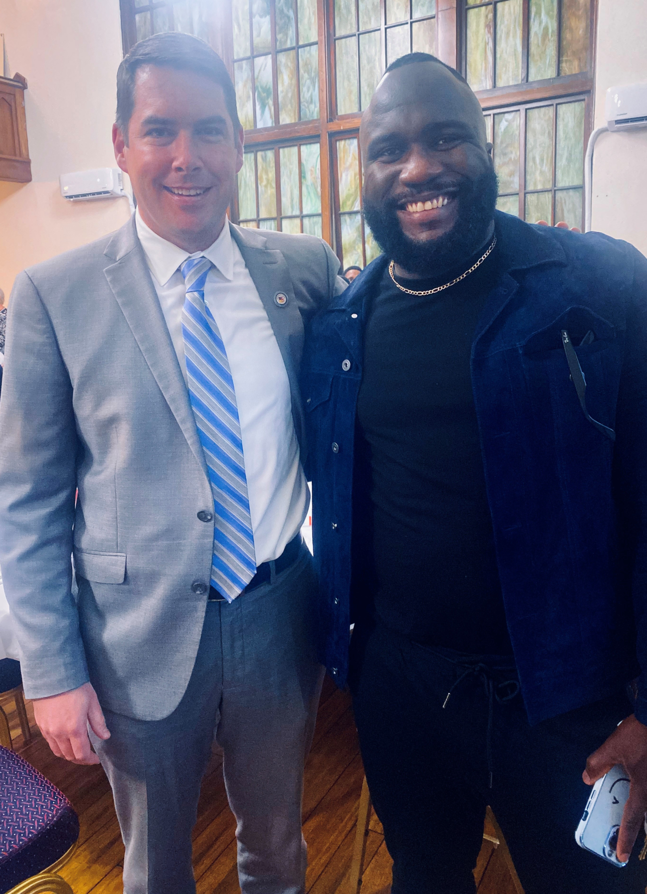 Romeo Kpolo '15 (right) with Syracuse Mayor Ben Walsh (left).