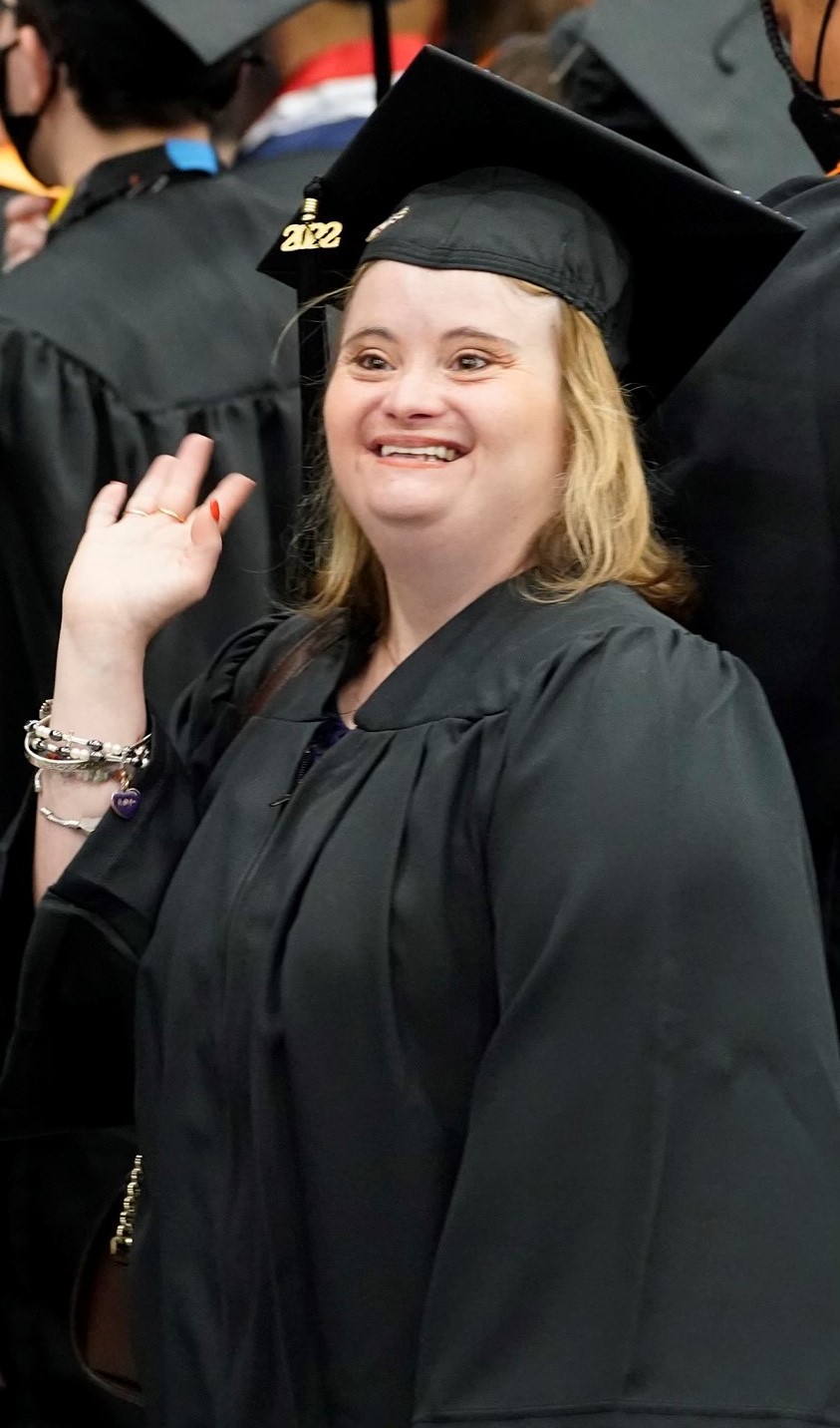 McKeon waves to family members during OCC's 2022 commencement ceremony.