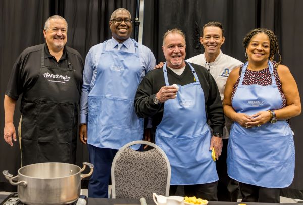 Participating in the Celebrity Cookoff were (left to right) James A. Down of Pathfinder Bank, OCC President Dr. Warren Hilton, Mark Re '85 of Howard Hanna Real Estate, OCC Hospitality Management Chef James Taylor who emceed the event, and New York State Assemblymember Pamela Hunter.