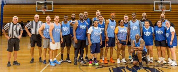 Participants in the 3-on-3 Basketball Challenge pose for a group photo in the Allyn Hall Gym.