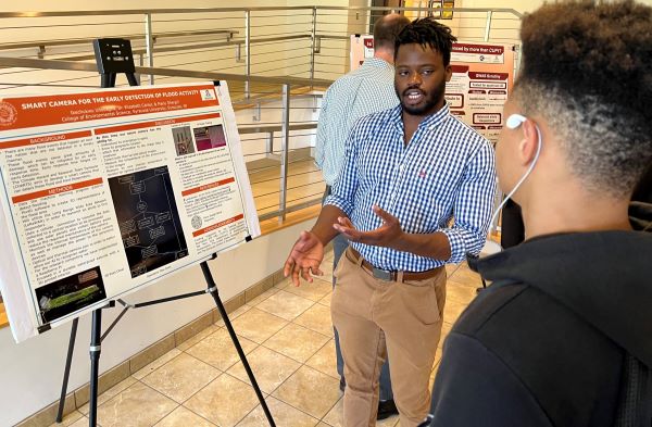 Ike Unobagha (left) did his summer research at Syracuse University. He completed his Mathematics & Science degree at OCC in May and is now a student at S.U.