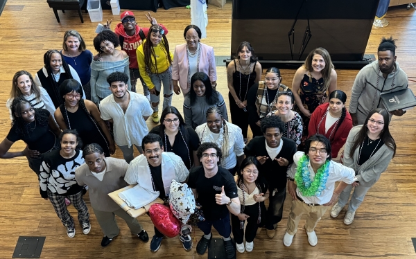 Students and staff in OCC's Opportunity Programs are pictured on stage in the Frederick Marvin and Ernst Schuh Recital Hall.