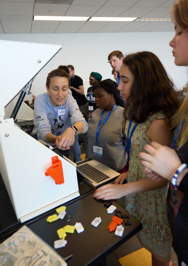 Stevens works with students during the Micron-sponsored "Girls Going Tech" event.