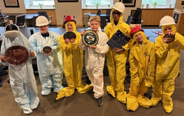 Students tried on bunny suits and experimented with Virtual Reality goggles during Micron-sponsored Chip Camp.