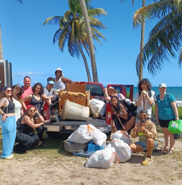 Students spent one day cleaning up a beach impacted by a hurricane.