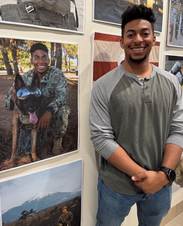 Jonathan Yard is pictured with a Belgian Malinois dog. Yard served 6 years in the Navy. He's a student at OCC.