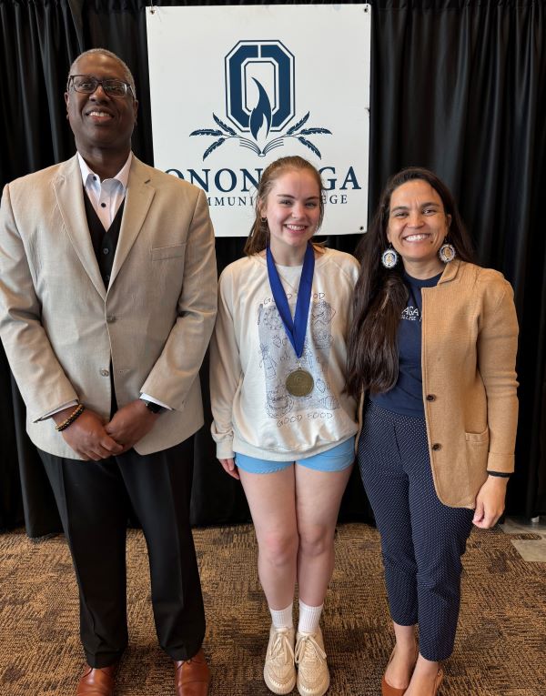 The Pinnacle Award recipient for Residence Life is Evangeline Hooper (center). Also pictured are her presenter Kim Fuqua (right) and OCC President Dr. Warren Hilton.
