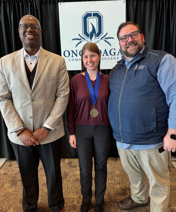 The Pinnacle Award recipient for Student Government is Alicia Oberlender (center). Also pictured are her presenter Shawn Edie (right) and OCC President Dr. Warren Hilton (left).