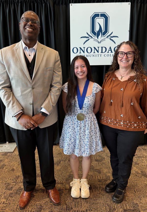 The Pinnacle Award recipient for the PTK Honor Society is Bianca Gascon (center). Also pictured are presenter Jackie Barstow (right) and OCC President Dr. Warren Hilton (left).