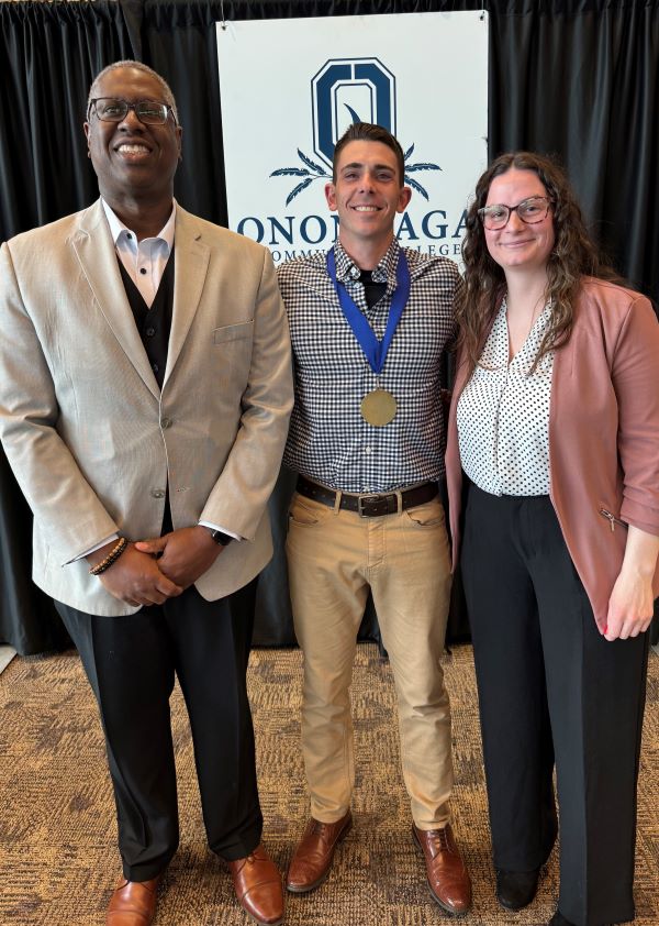 The Pinnacle Award recipient for the Office of Accessibility Resources is Hunter Yessick (center). He's pictured with presenter Ashley Sherman (right) and OCC President Dr. Warren Hilton (left).