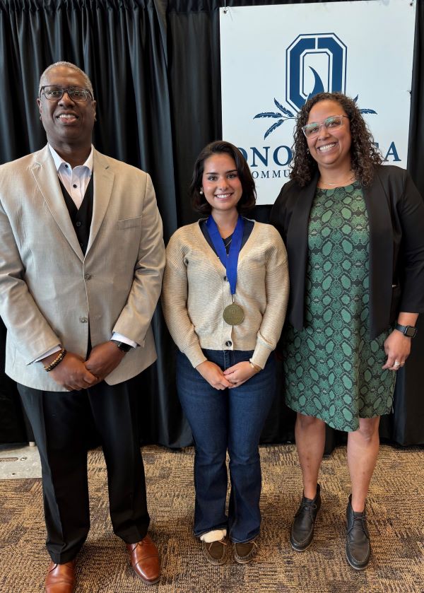 The Pinnacle Award recipient for LSAMP is Isabella Alvarez-Lazcano (center). Also pictured are presenter Naomi Campbell (right) and OCC President Dr. Warren Hilton (left).