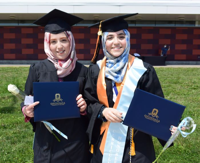 Twin sisters Fidaa (left) and Nidaa (right) Aljabarrin graduated from OCC togther in 2020. Fidaa is a respiratory therapist at SUNY Upstate Medical University, and Nidaa will complete a medical degree in November.