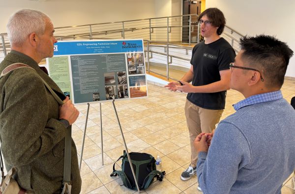 Aiden Knapp (wearing black t-shirt) talked about serving as a Engineering Technician Intern with Texas Instruments in Dallas.