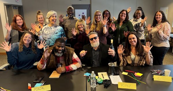 Professor Rumrill-Teece and members of Onondaga County Child Protective Services share a lighter moment during their workshop series.