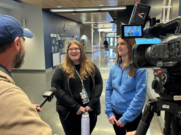 Sisters Jessica Matzke of Wheeler Elementary School (left) and Katelyn Pulver of Onondaga Community College (right) were interviewed by Spectrum TV's Mike Kuehner during Education Day.