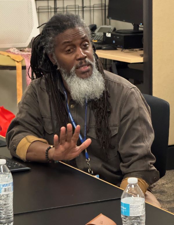 Jimmy Anderson speaks with student veterans during a weekly meeting of the Veterans Support Group.