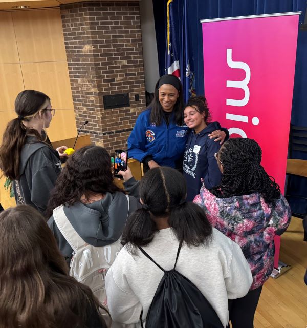 Students lined up for photos with astronaut Dr. Jeannette Epps after listening to her presentation in Storer Auditorium.
