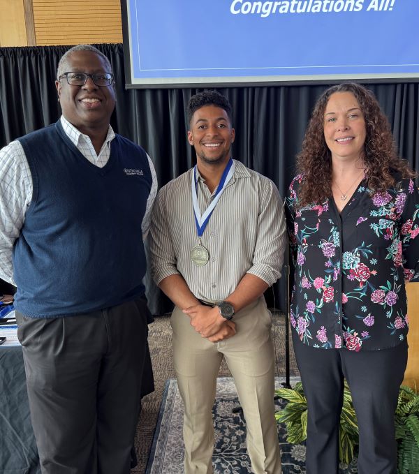 The Office of Veterans and Military Services Pinnacle Award was presented to Jonathan Yard (center) by OCC President Dr. Warren Hilton (left) and Lisa Mooney (right), Coordinator of Veterans and Military Services.