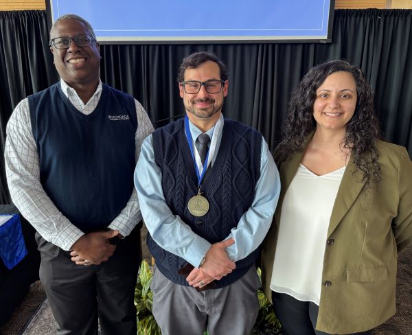 Phil Impaglia (center) received the Pinnacle Award from OCC President Dr. Warren Hilton (left) and Dana Acee (right).