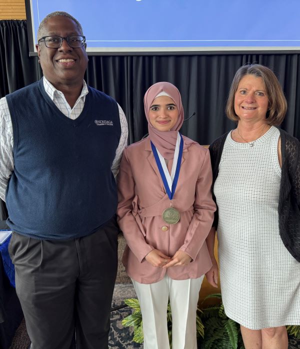 The Pinnacle Award for TRIO was presented to Maram Al Talen from PCC President Dr. Warren Hilton (left) and Kim Carlson of TRIO (right).
