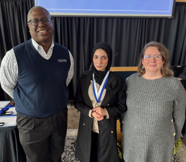 Tasneem Ghayad (center) won the Pinnacle Award for the Educational Opportunity Program. She's pictured with OCC President Dr. Warren Hilton (left) and EOP Director Michelle Woodhouse (right).
