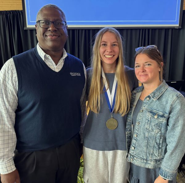 Mary Hamer (center) received the Pinnacle Award from Residence Life from OCC President Dr. Warren Hilton (left) and Kelly Seibt (right).