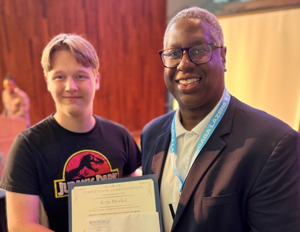Kyle Morkel (left) was congratulated by Onondaga Community College President Dr. Warren Hilton (right) for completing the Pre-College Semiconductor Summer Program. Morkel will be an 11th grade student at Chittenango high School this fall.