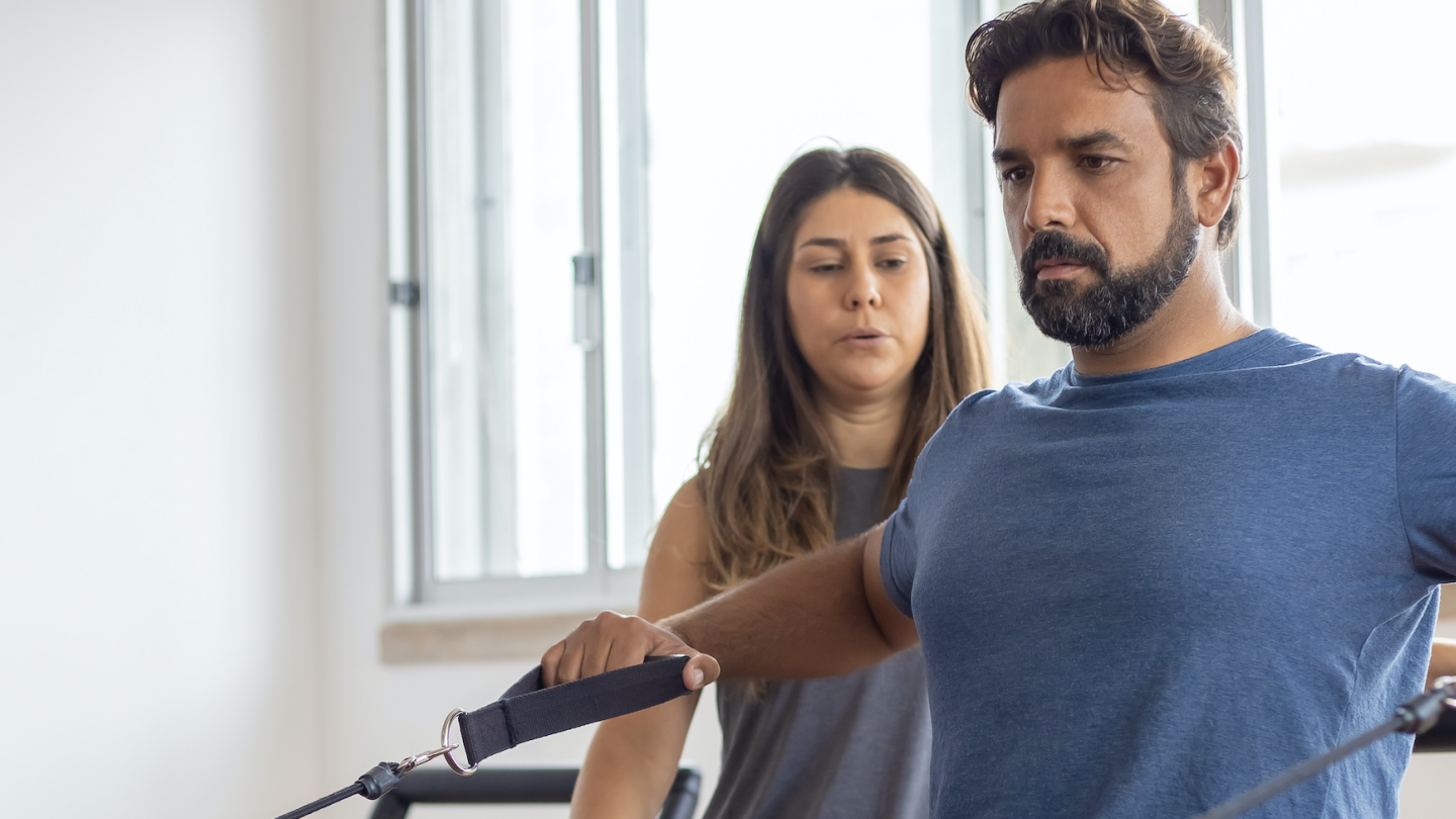 Physical therapist coaching patient