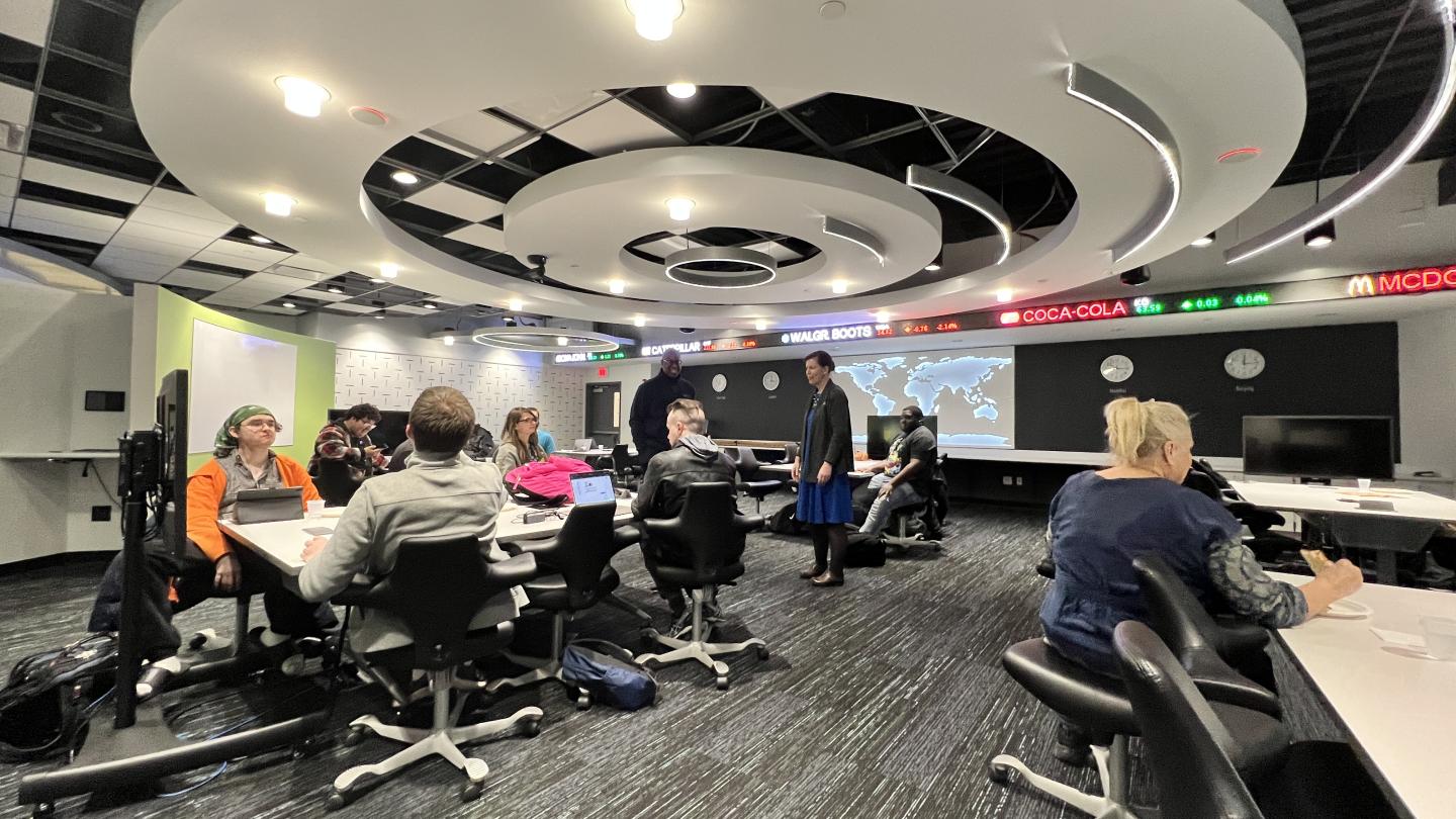 Students sitting at tables in the business classroom