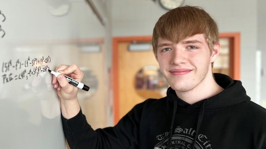 Maximus Wunderlich works on a calculus equation in the Whitney Applied Technology Center. He's a 12th grader in Spartan Academy who will complete his Mathematics & Science degree this semester.