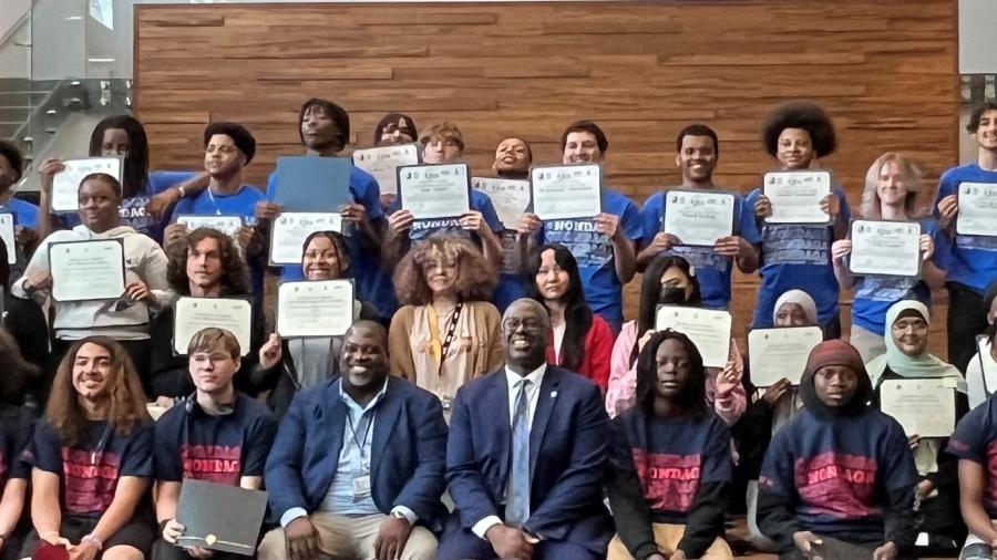 Syracuse City School District students and supporters of the P-TECH program pose for a group photo at Onondaga Community College.