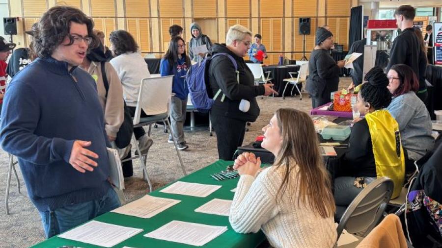 Students speak with employers during Onondaga Community College's first of three Career Showcases.