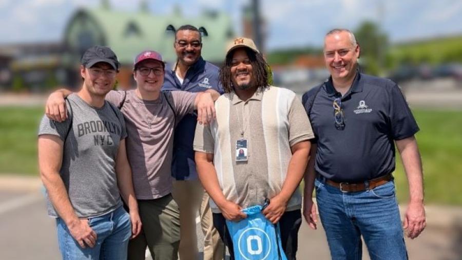 OCC's Director of Central New York Partnerships Dr. Reginald T. Braggs (center) met with OCC students interning at Micron in Virginia (left to right) Logan Peplinski, Nick Hay, Parris Holloman, and Alec Del Gigante.