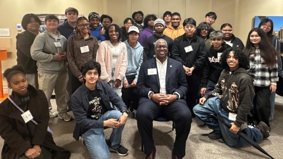 Onondaga Community College President Dr. Warren Hilton (seated) is pictured with students who participated in the first Pre-College Semiconductor Summer Program. 