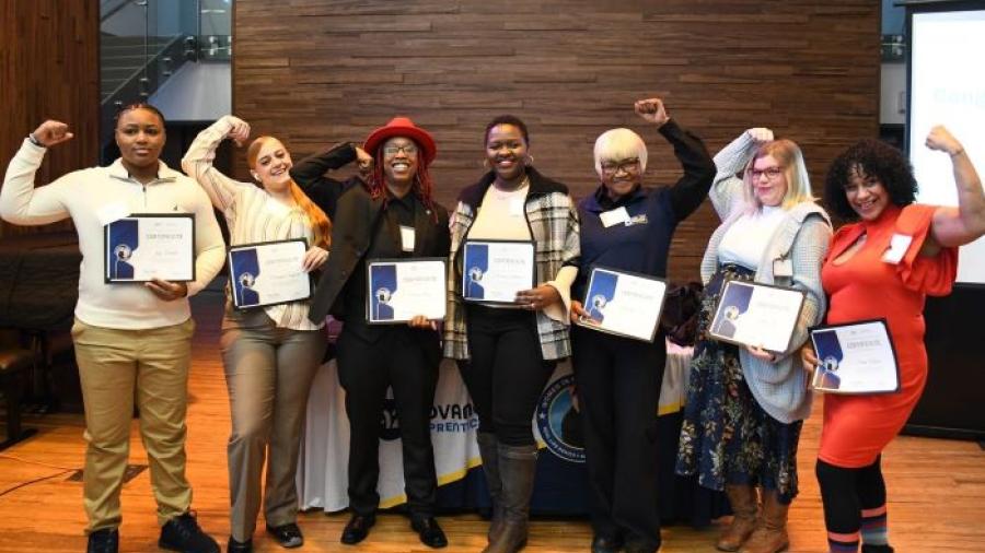Real Life Rosie program graduates pose for a group photo at their graduation ceremony on the Onondaga Community College campus.