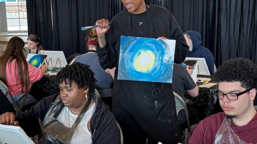 Nikki Hendrix shares her story with students during her painting therapy workshop in the Gordon Student Center.