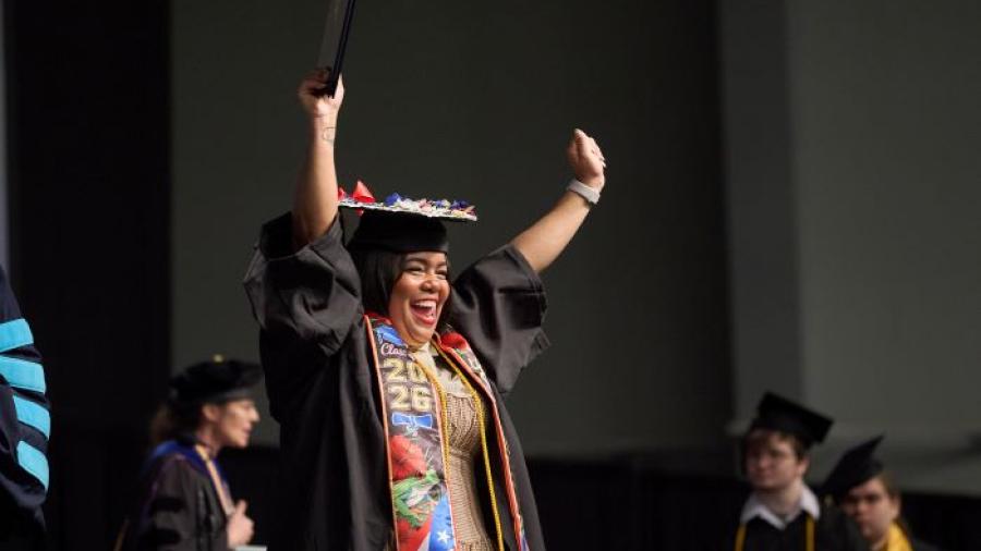 Students celebrated reaching the finish line as they crossed the stage in the SRC Arena during Onondaga Community College's commencement ceremony.